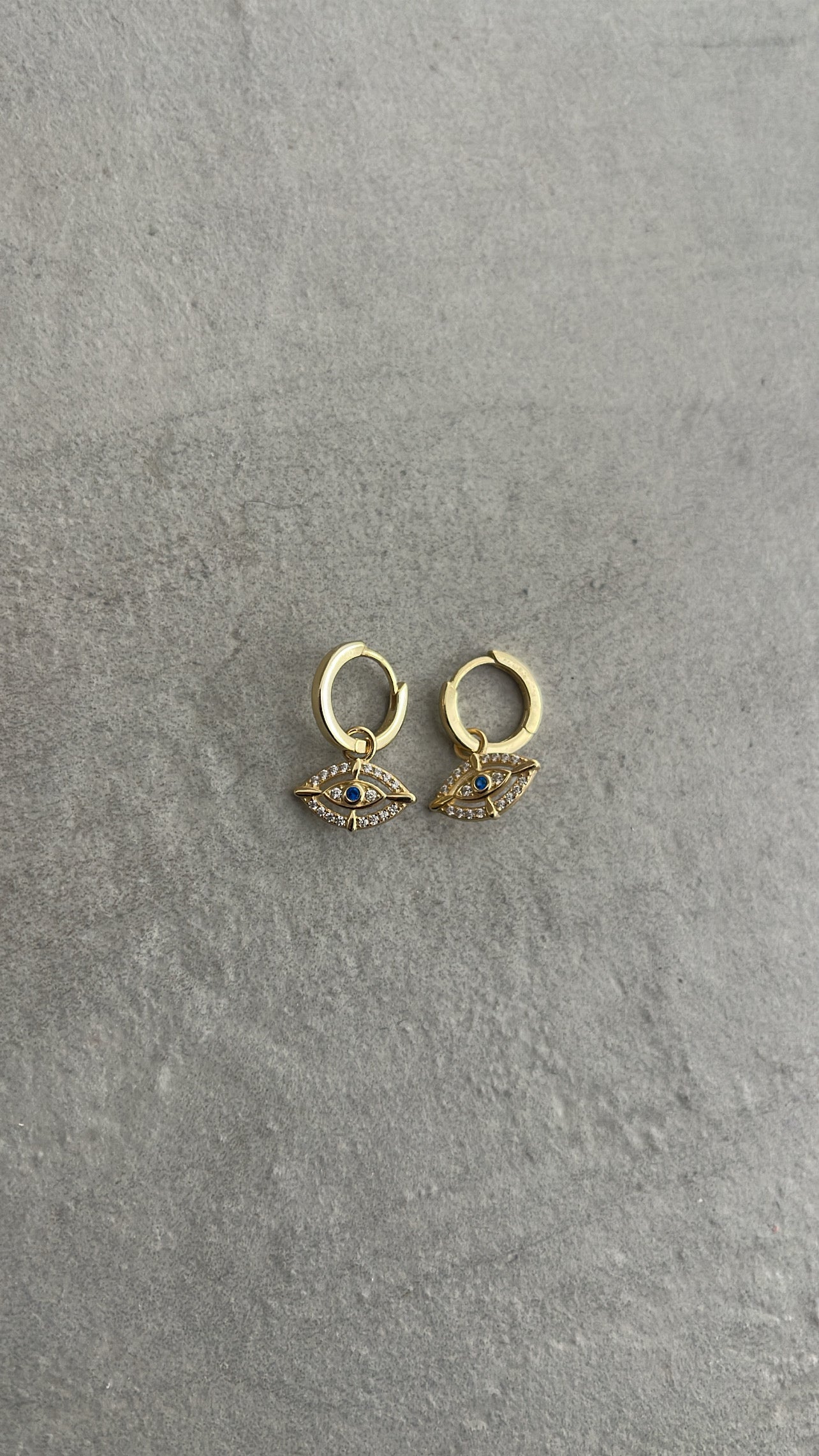 Eye hoop earrings