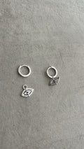 Eye hoop earrings