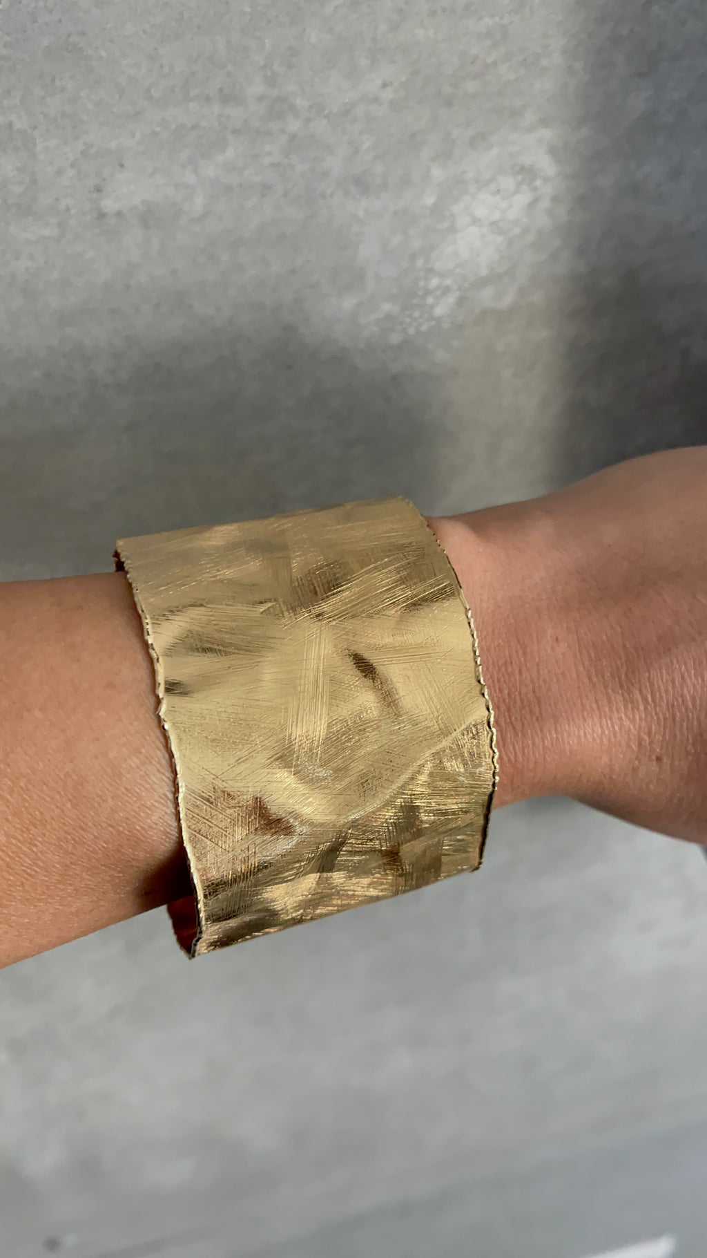 Gold bracelet on a white background