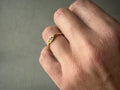 Hand wearing an eye ring